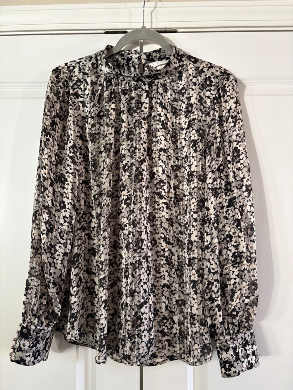H&M Black and White Floral Tie-Neck Blouse with Tan Accents
